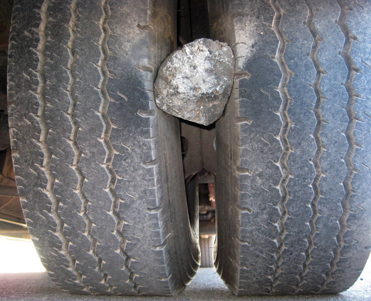 TITLE 201903  STONE BETWEEN TRUCK’S DUAL TYRES BECAME
